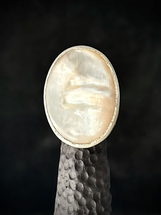 Large oval mother of pearl ring in brushed sterling silver bezel, front view