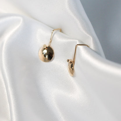 golden dangling disc earrings • 14ct gold plated