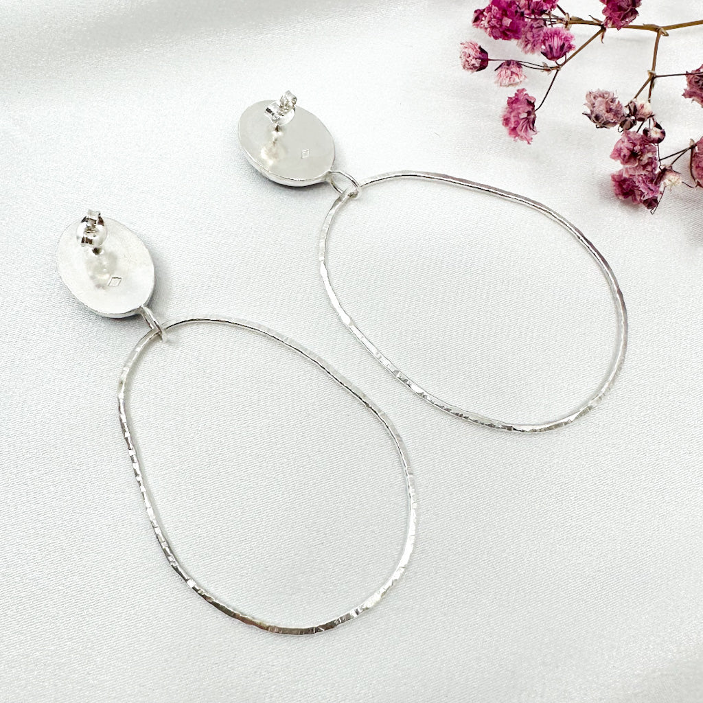long dangly silver earrings with oval amethyst