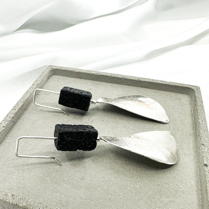 long dangly silver earrings with black lava stone