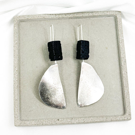 long dangly silver earrings with black lava stone