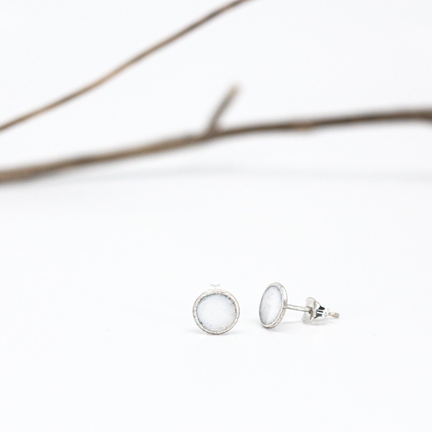 small minimalist round sterling silver stud earrings with white or grey or black resin