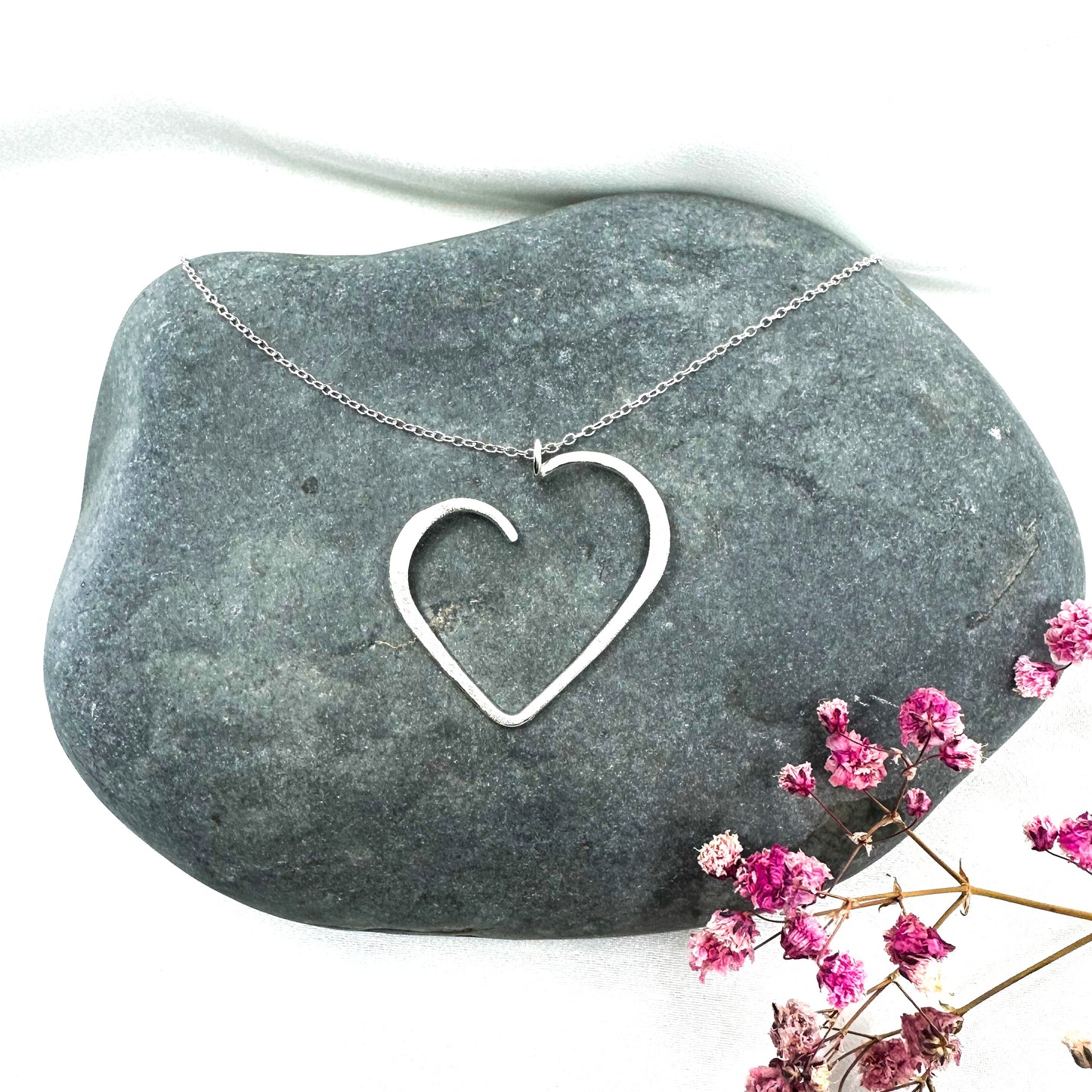 set of sterling silver heart pendant necklace and matching stud earrings