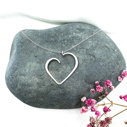 set of sterling silver heart pendant necklace and matching stud earrings
