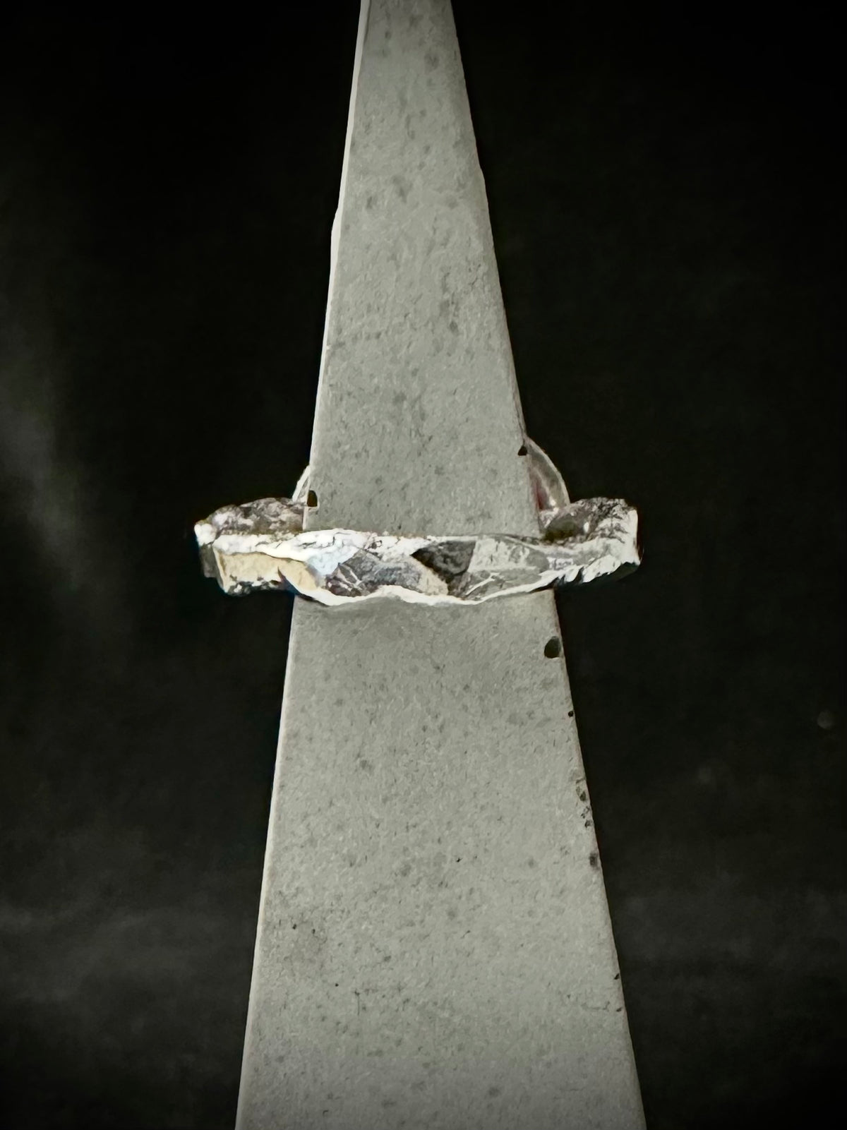 Side view of rippled recycled sterling silver ring band