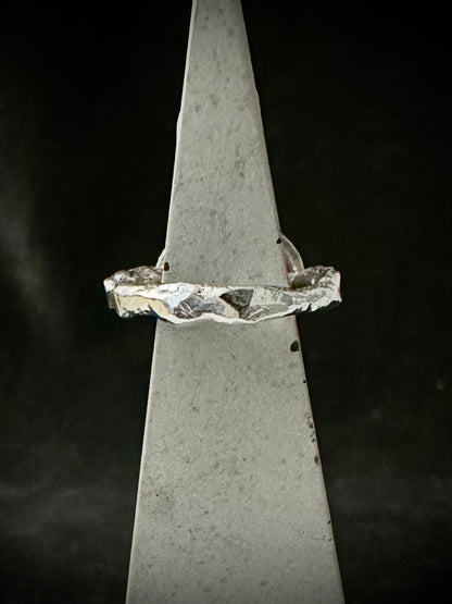 Side view of rippled recycled sterling silver ring band