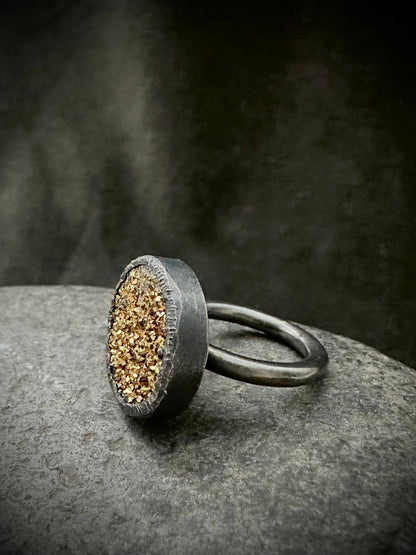 Handmade rustic silver ring with textured rim, profile view