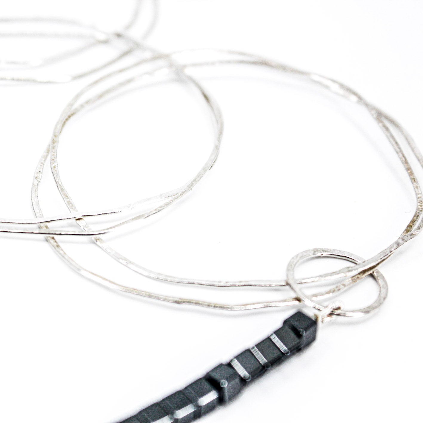 extra long minimalist statement necklace with hematite cubes and sterling silver rings