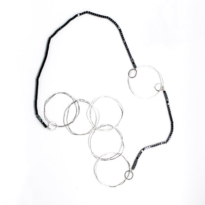 extra long minimalist statement necklace with hematite cubes and sterling silver rings