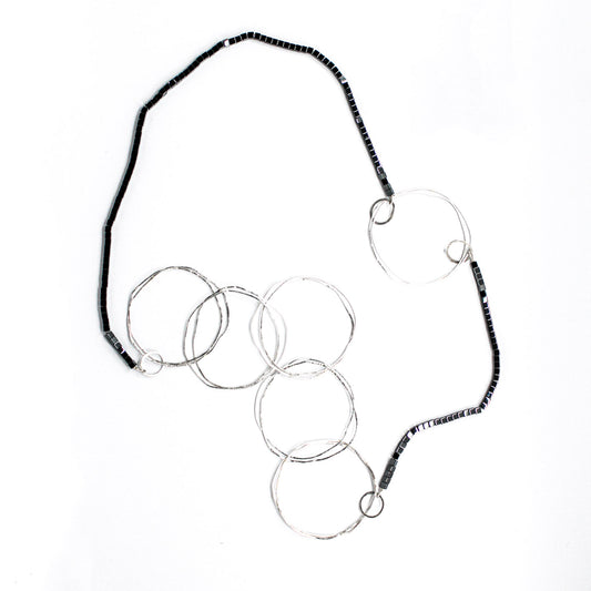 extra long minimalist statement necklace with hematite cubes and sterling silver rings