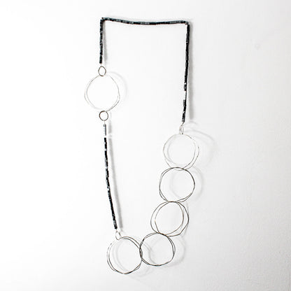 extra long minimalist statement necklace with hematite cubes and sterling silver rings