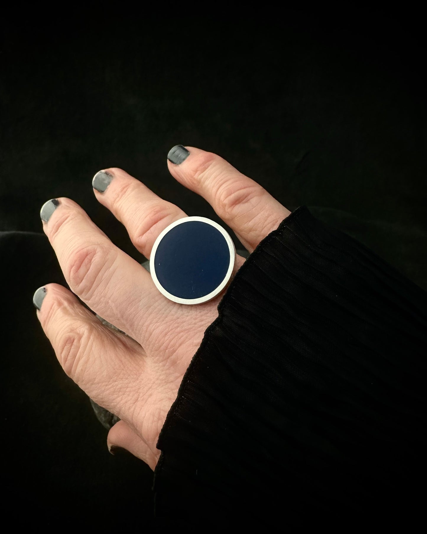 Dark blue resin statement ring in solid 925 sterling silver, on hand