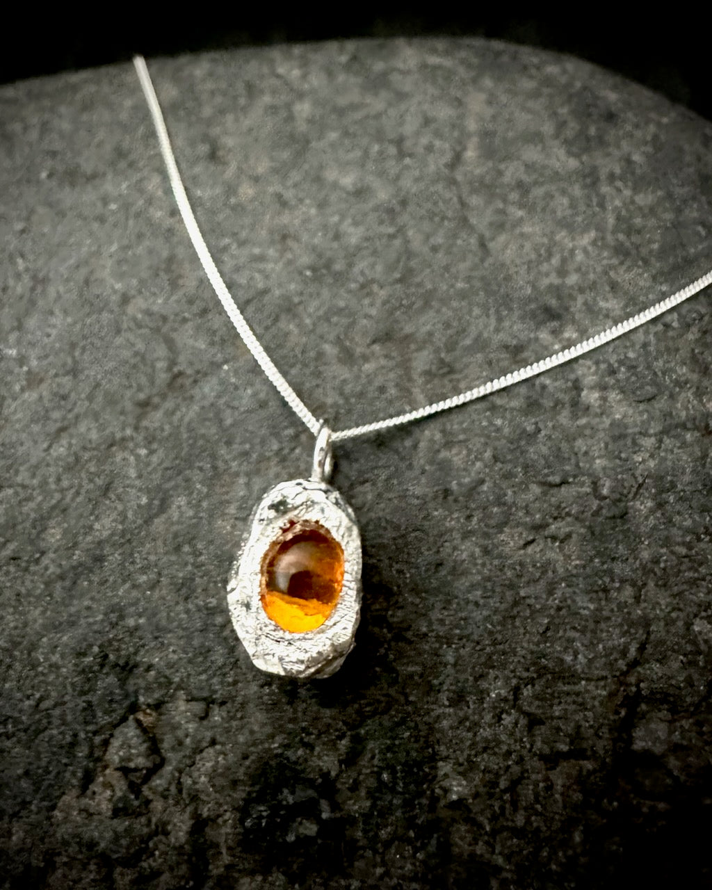 Textured sterling silver pendant with oval amber stone, sculptural handmade jewellery
