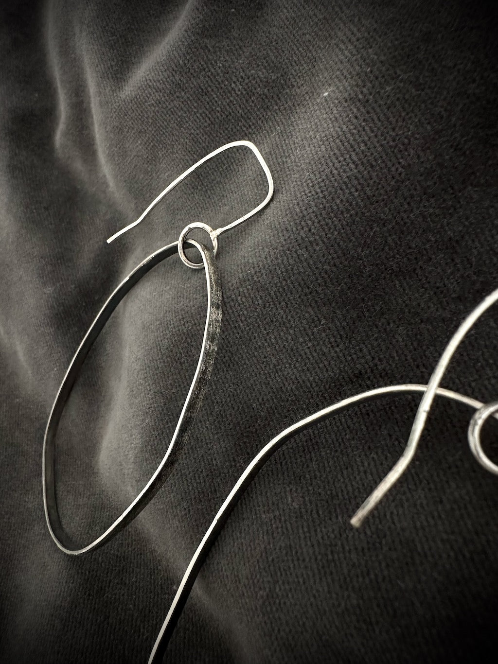 Oxidised sterling silver hoop earring close-up - hammered wire detail
