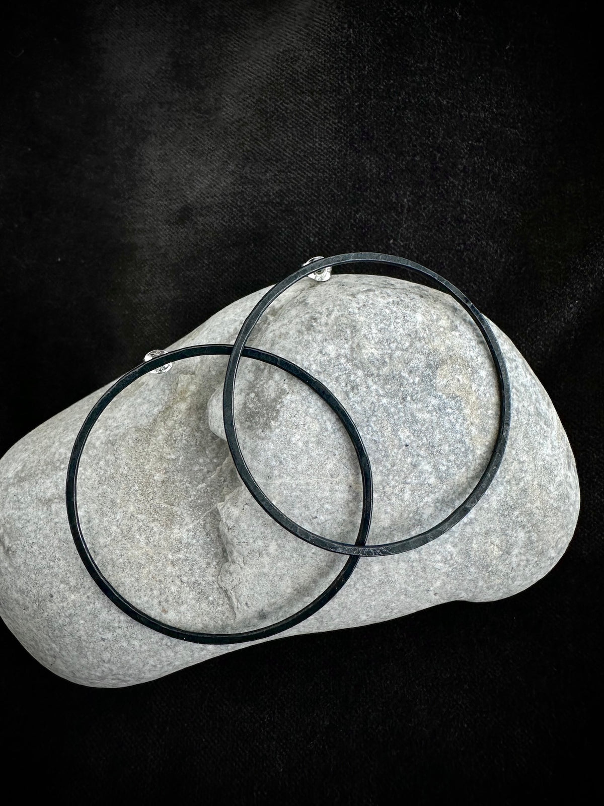 Oxidised sterling silver hoop earrings on stone - blackened handmade jewelry