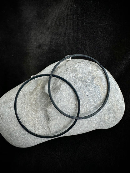 Oxidised sterling silver hoop earrings on stone - blackened handmade jewelry