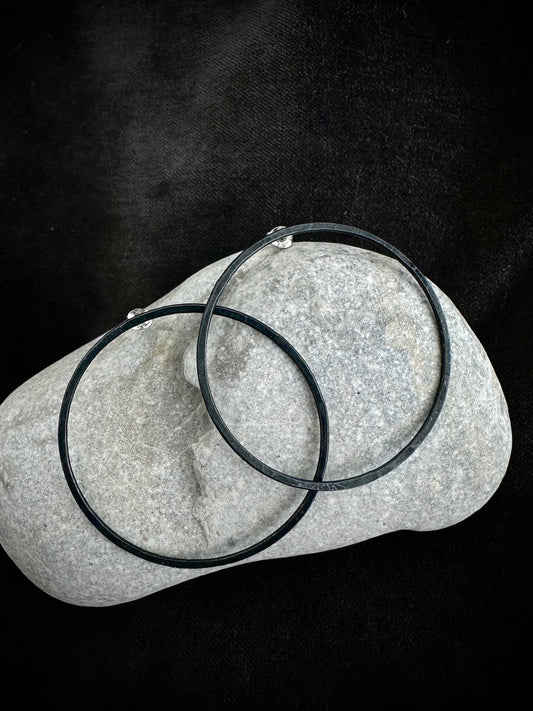 Oxidised sterling silver hoop earrings on stone - blackened handmade jewelry