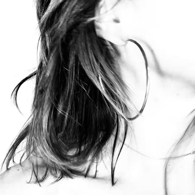 Large minimalist hoop earrings in brass and eco sterling silver – handmade two-tone jewellery by Sabine Werner