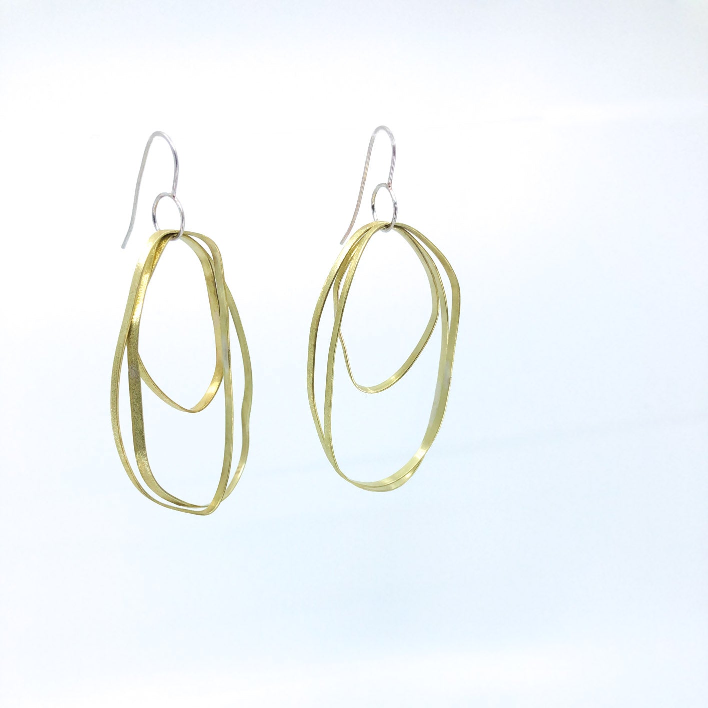 long dangling brass earrings with sterling silver hook • three textured free form elements