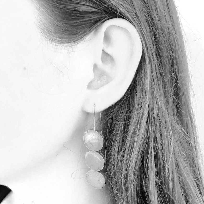 long grey dangly sterling silver earrings with three round resin elements