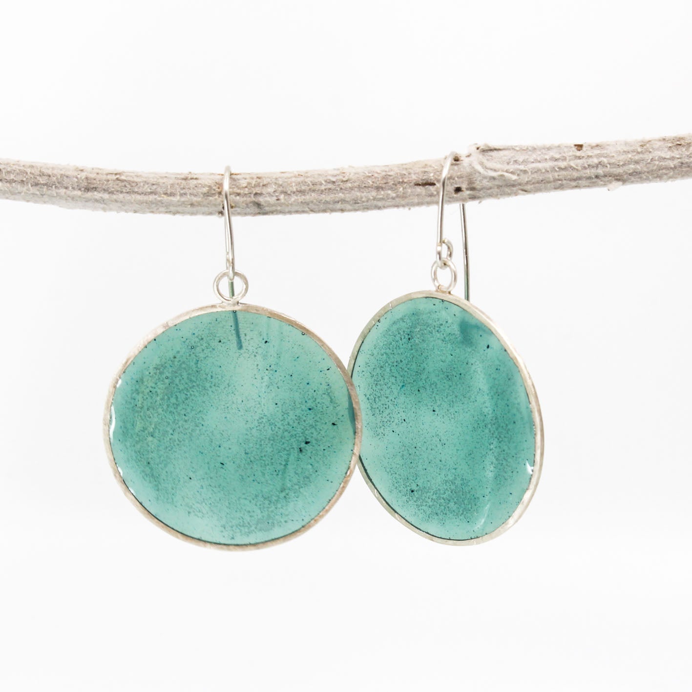 green dangling resin earrings in sterling silver