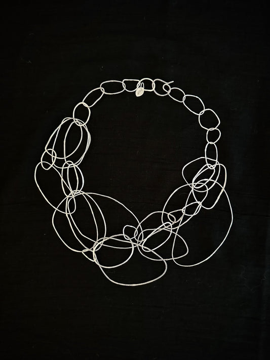 Sculptural sterling silver loop necklace handmade by Sabine Werner