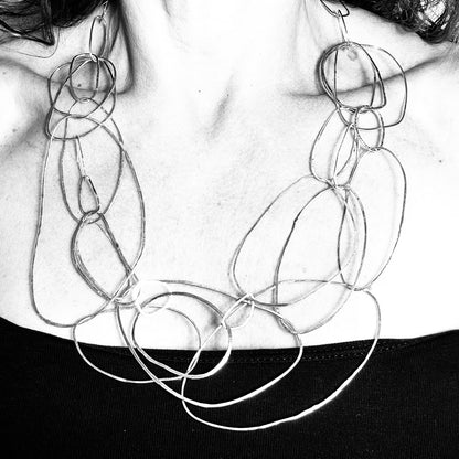 Handmade sterling silver statement necklace worn on model